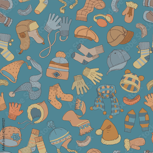 Cap, gloves, scarf, socks. Winter accessories, seamless pattern. Hand drawn vector illustration.
