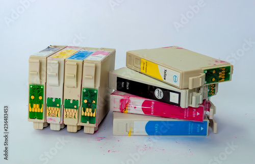 Принти на полотні A jumbled stack of empty ink-jet printer cartridges on a white background
