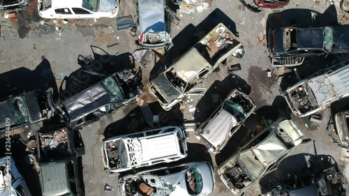 Aerial shot of cars (zooming out) that where wrecked and totaled by hurricane Irma on Tortola, BVI, 2017 photo