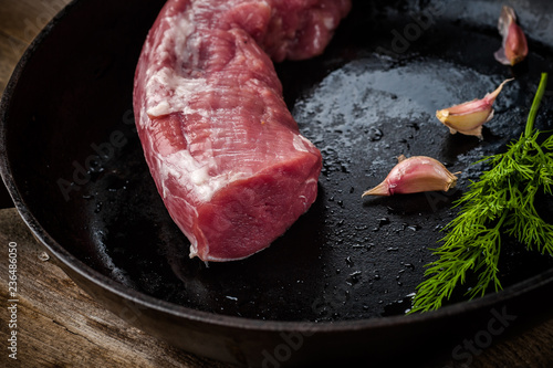 fresh meat on a wooden board. Steak, ribs polar bear, heel