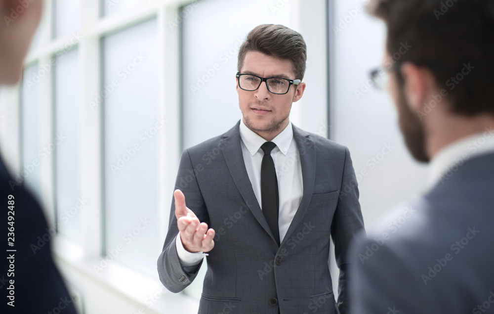 boss is discussing something with his employees boss is discussing something with his employees