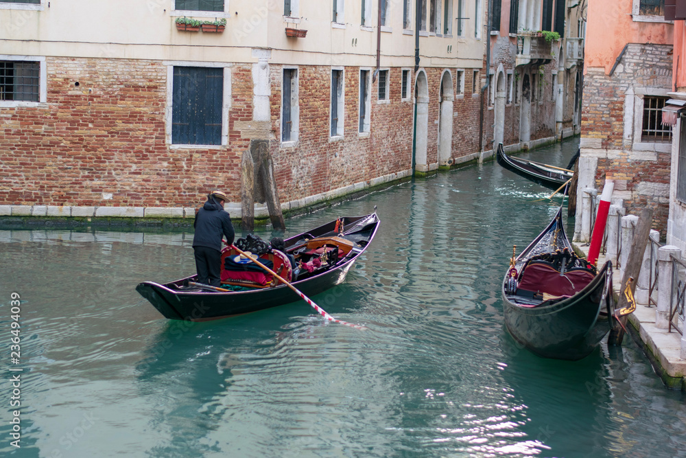 gondolas on a water channel in venice