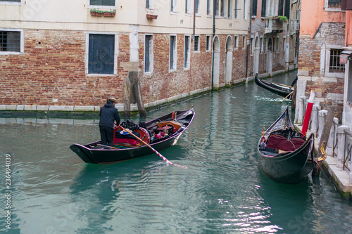 gondolas on a water channel in venice © Florincristian