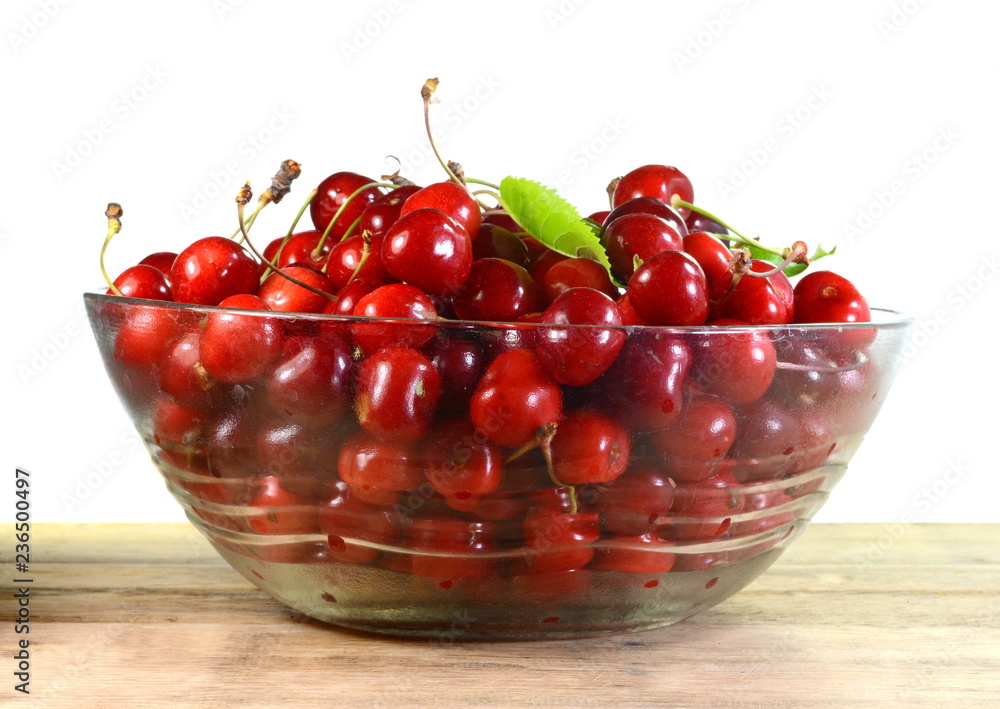 Cherries in a bowl isolated on white Cherries in a bowl isolated on white