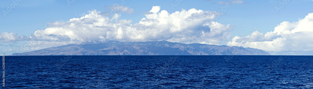 Tenerife Island in the clouds from the open ocean