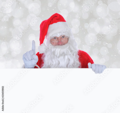 Santa Claus with a Blank Sign with Copy Space © Steve Cukrov