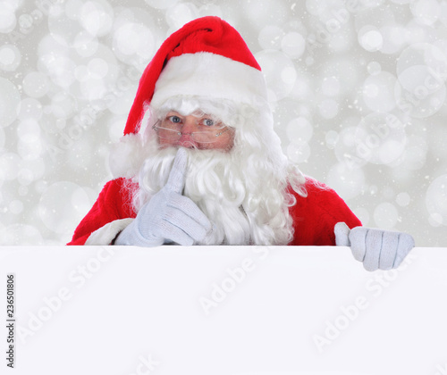 Santa Claus with a Blank Sign making Shh gesture © Steve Cukrov