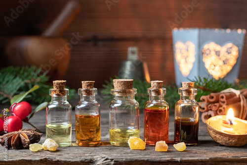 Christmas selection of essential oils with frankincense, wintergreen and star anise
