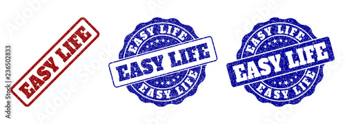EASY LIFE grunge stamp seals in red and blue colors. Vector EASY LIFE labels with scratced surface. Graphic elements are rounded rectangles, rosettes, circles and text labels.