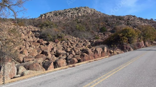 View of rocks along road through Wichita Mountains in National park in Oklahoma.