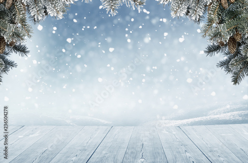 Merry Christmas and happy New Year greeting background with table .Winter landscape with fir tree branch