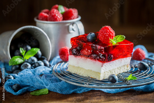 Closeup of homemade cake with jelly and berry fruits