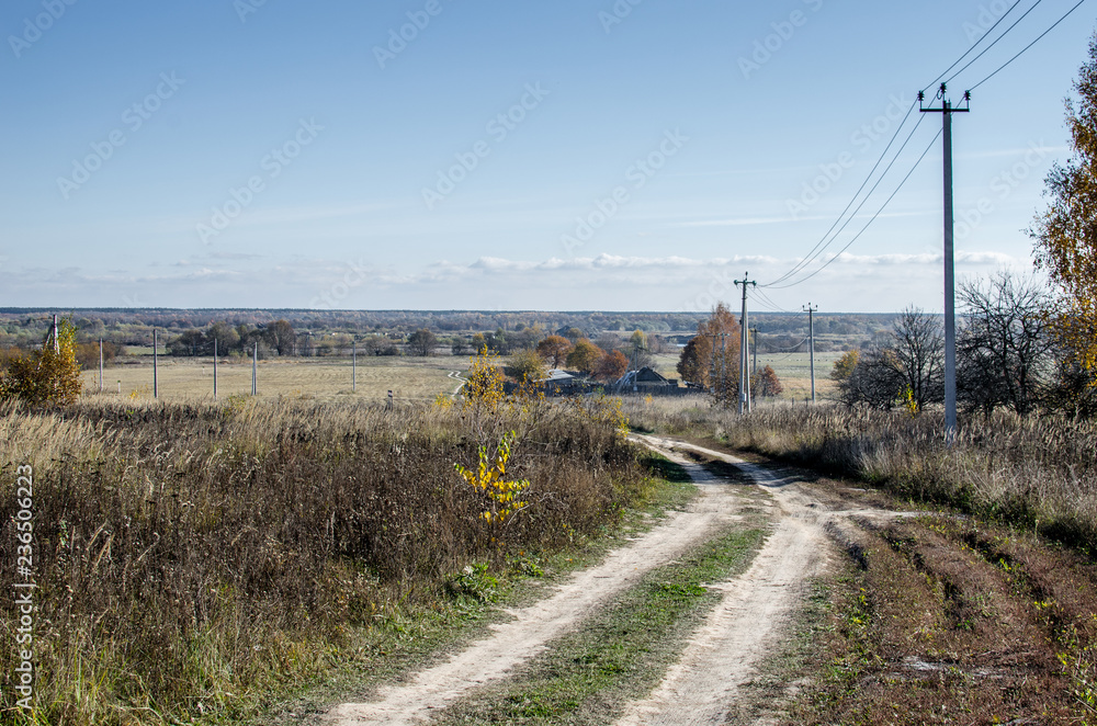 Countryside Dirt Road. The long and winding rural path crosses the hills.
