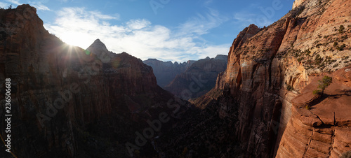 Beautiful aerial panoramic landscape view of a Canyon during a vibrant sunny sunset. Taken in Zion National Park, Utah, United States. © edb3_16