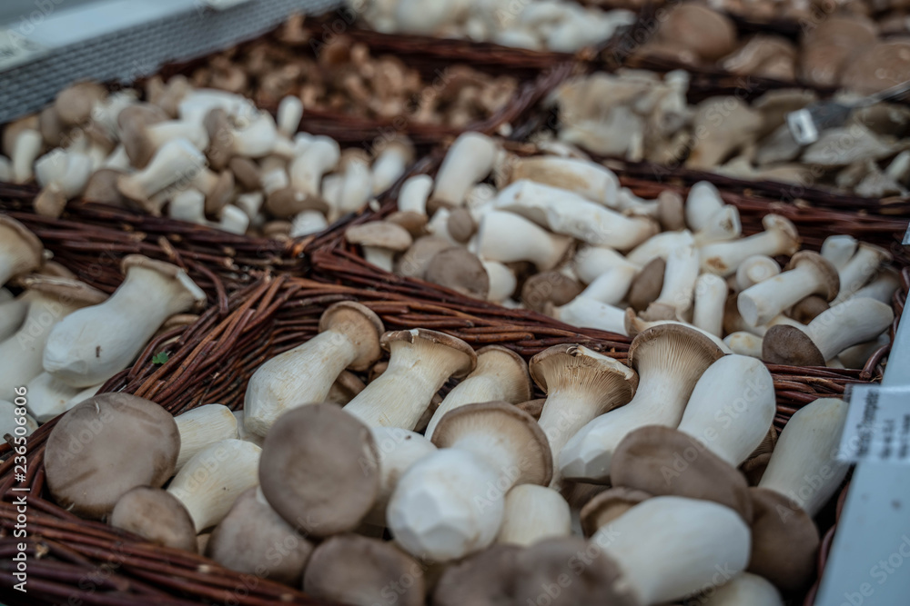 fresh mushrooms on sale in a wicker basket fresh mushrooms on sale in a wicker basket