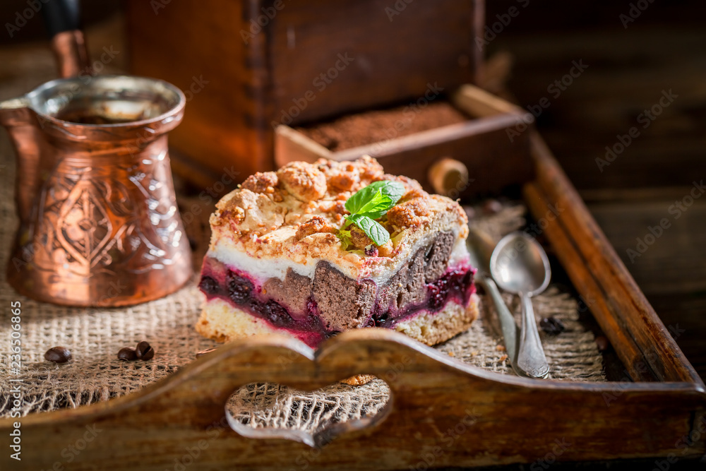 Sweet cherry pie with pot boiled coffee on wooden tray