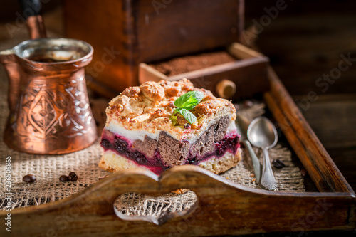 Sweet cherry pie with pot boiled coffee on wooden tray © shaiith