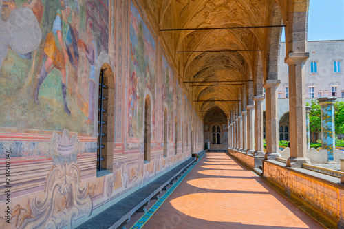 Old paintings decorate the cloister walls of Santa Chiara Monastery in Naples, Italy.
