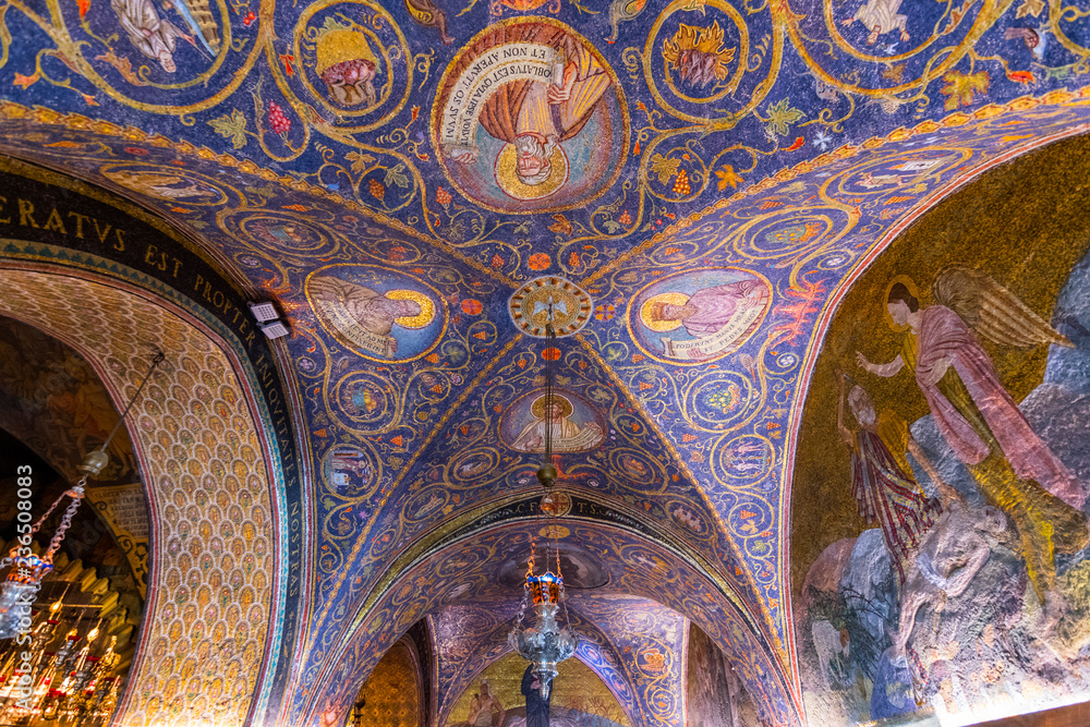 The interior of the Latin Calvary Chapel in the Church of the Holy Sepulchre, decorated with the colorful mosaic patterns and icons, Jerusalem Israel.