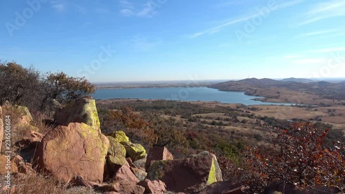 View of landscape with plain and road,  and part of mountain rocks. View from Wichita Mountains.