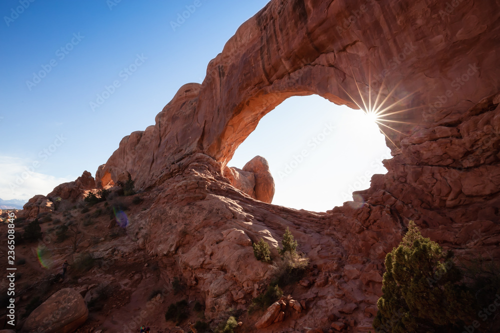 Scenic landscape of an Arch rock formation during a vibrant sunny day. Taken in Arches National Park, located near Moab, Utah, United States.