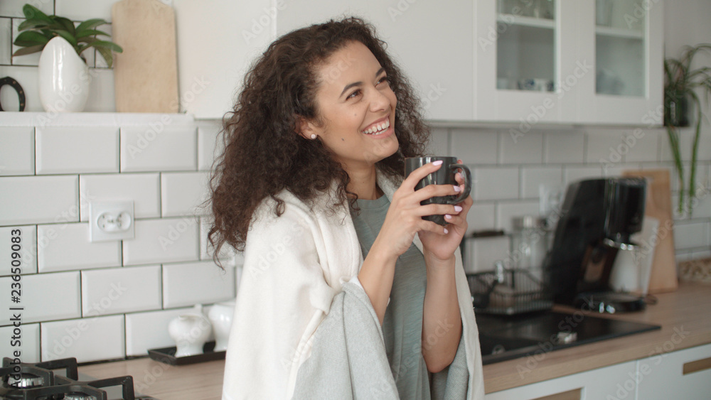 Portrait of smiling woman drinking coffee or tea at home. Portrait of smiling woman drinking coffee or tea at home.