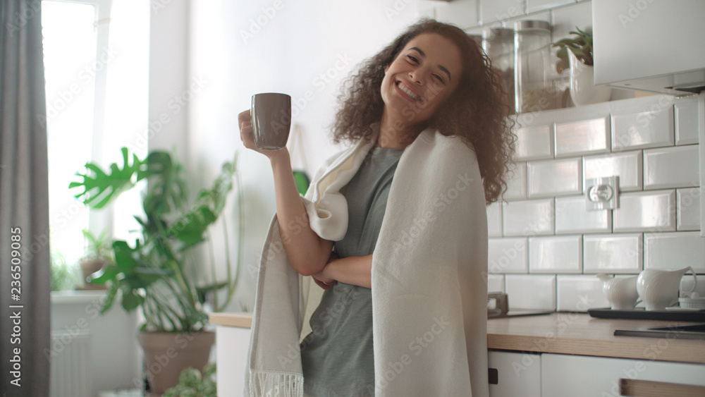 Portrait of smiling woman drinking coffee or tea at home. Portrait of smiling woman drinking coffee or tea at home.