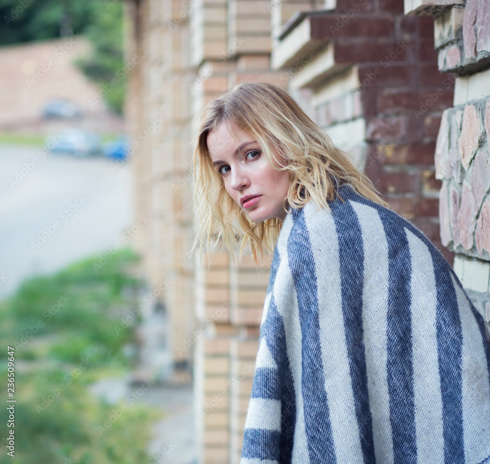 Portrait of a young girl on the background of a city street. Format image square. Portrait of a young girl on the background of a city street. Format image square.