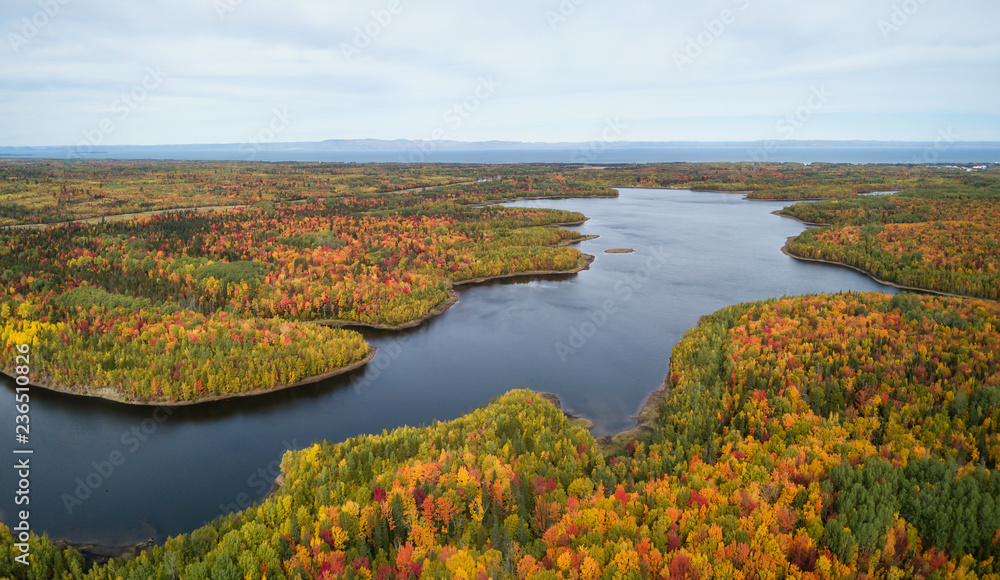 Fototapeta premium Aerial panoramic view of a beautiful Canadian Landscape during fall color season. Taken near Belledune, New Brunswick, Canada.