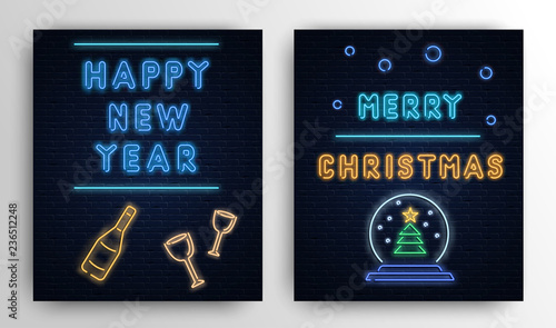 Christmas and New Year neon luminous cards on brick textured background.