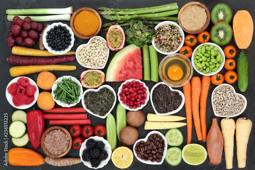 Fototapeta Naklejka Na Ścianę i Meble -  Health food for clean eating concept including grains, seeds, coffee, supplement powders, fresh fruit, vegetables and dairy. High in antioxidants, protein, anthocyanins, vitamins and dietary fibre.  
