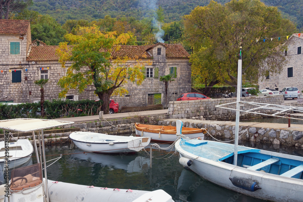 Autumn day in small Mediterranean town. Montenegro, Adriatic Sea, Bay of Kotor. View of ancient town of Stoliv Autumn day in small Mediterranean town. Montenegro, Adriatic Sea, Bay of Kotor. View of ancient town of Stoliv