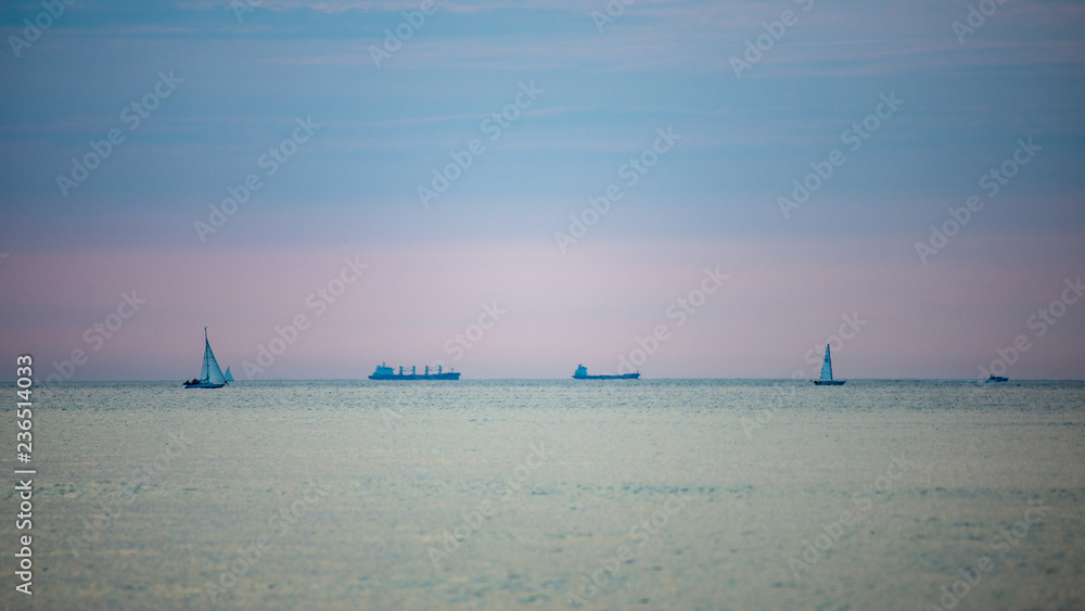 Obraz premium calm blue sunset over clear water in baltic sea
