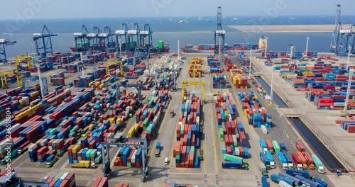 JAKARTA, Indonesia - November 28, 2018: Hyperlapse of Tanjung Priok industrial port with container yard and cargo ship, Jakarta, Indonesia. Shot in 4k resolution