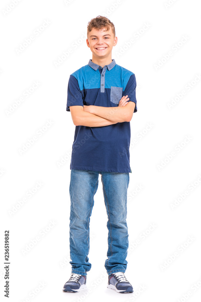 Full length portrait of young caucasian teen boy isolated on white background. Funny teenager with arms folded. Handsome child looking at camera and smiling. Full length portrait of young caucasian teen boy isolated on white background. Funny teenager with arms folded. Handsome child looking at camera and smiling.
