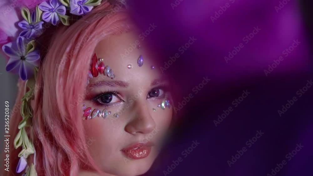 Closeup portrait of a beautifl young anime girl wearing full pink with flowers in her hair. Closeup portrait of a beautifl young anime girl wearing full pink with flowers in her hair.