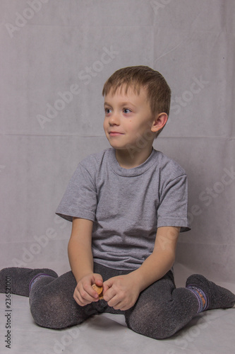 Happy boy in gray t-shirt smiling