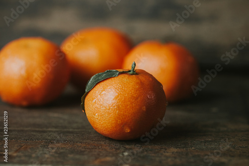 Tangerine on wooden background