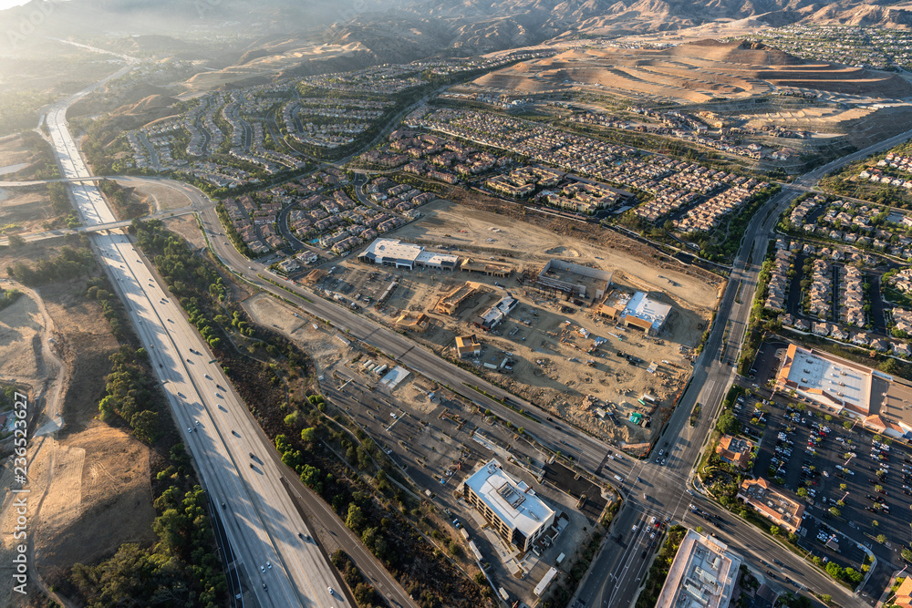Late afternoon aerial view of shopping center construction, Rinaldi Street and the 118 freeway in the Porter Ranch community of Los Angeles, California.