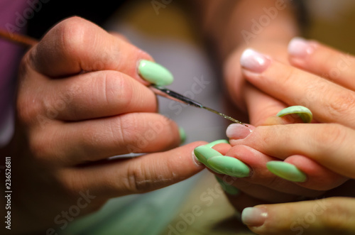 hand with tooth brush. manicure. beauty.