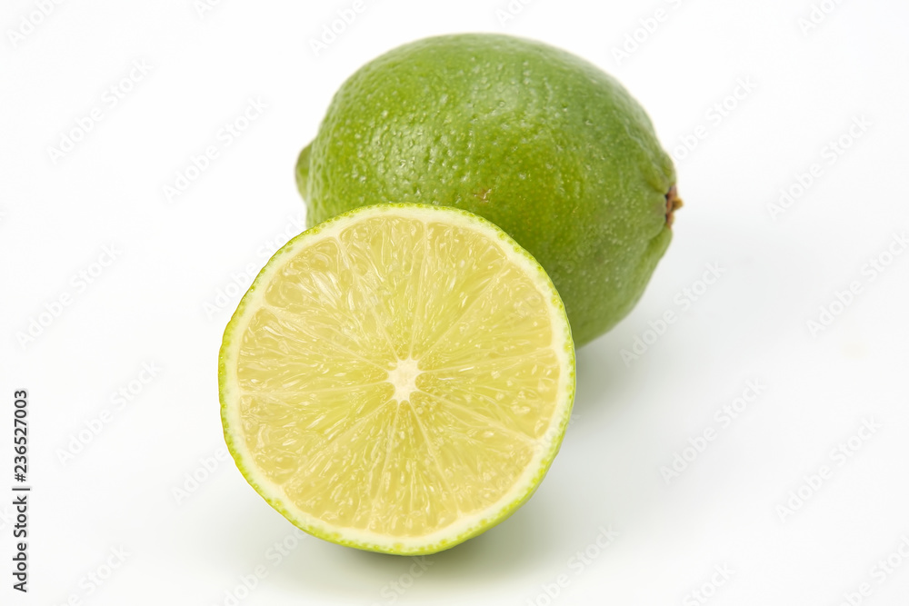 Cut citrus fruit of green lemon on white background Cut citrus fruit of green lemon on white background