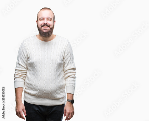 Young caucasian hipster man wearing winter sweater over isolated background with a happy and cool smile on face. Lucky person.
