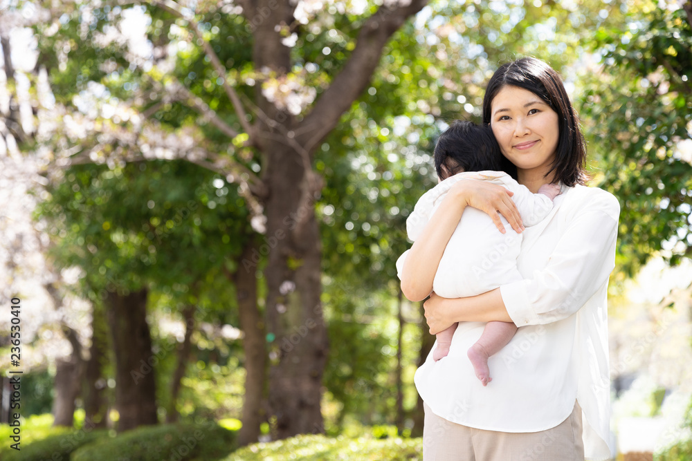 portrait of young asian mother and baby in park portrait of young asian mother and baby in park