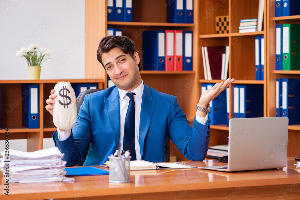 Young employee working in the office Young employee working in the office