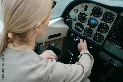 Female aviator in cockpit photo