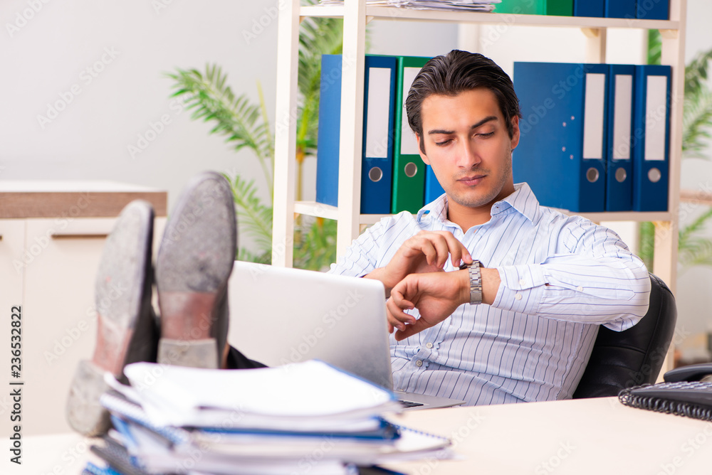 Young employee sitting at the office Young employee sitting at the office