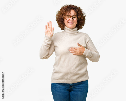 Beautiful middle ager senior woman wearing turtleneck sweater and glasses over isolated background Swearing with hand on chest and open palm, making a loyalty promise oath