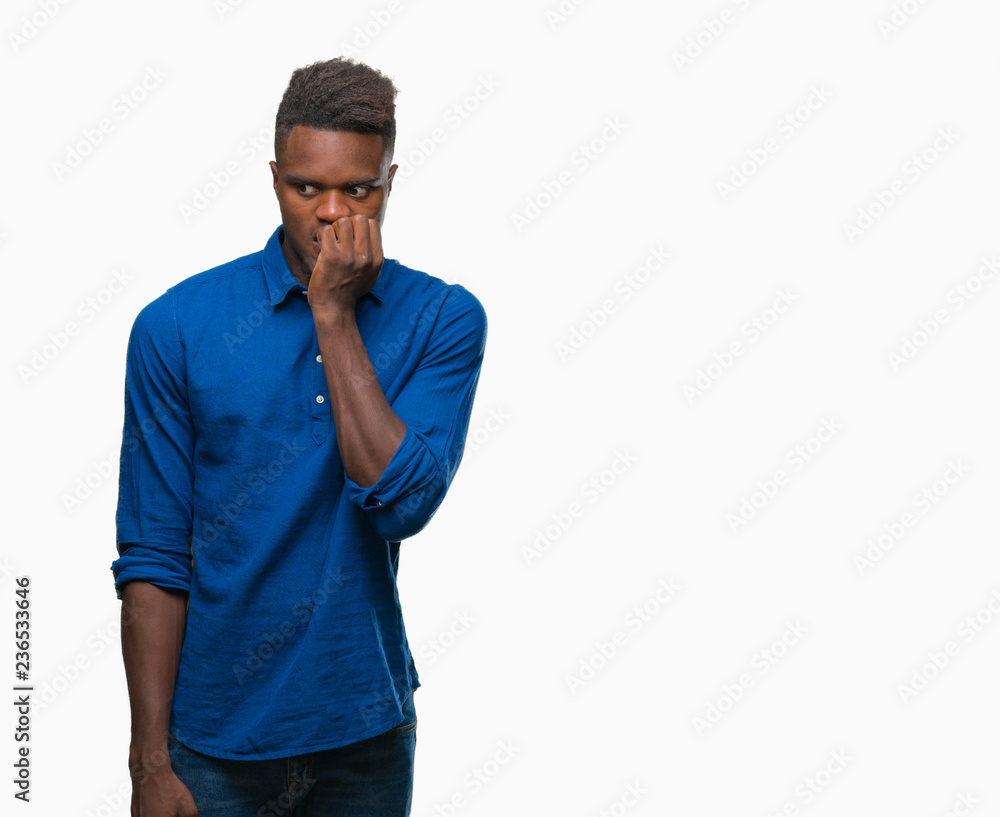 Young african american man over isolated background looking stressed and nervous with hands on mouth biting nails. Anxiety problem. Young african american man over isolated background looking stressed and nervous with hands on mouth biting nails. Anxiety problem.