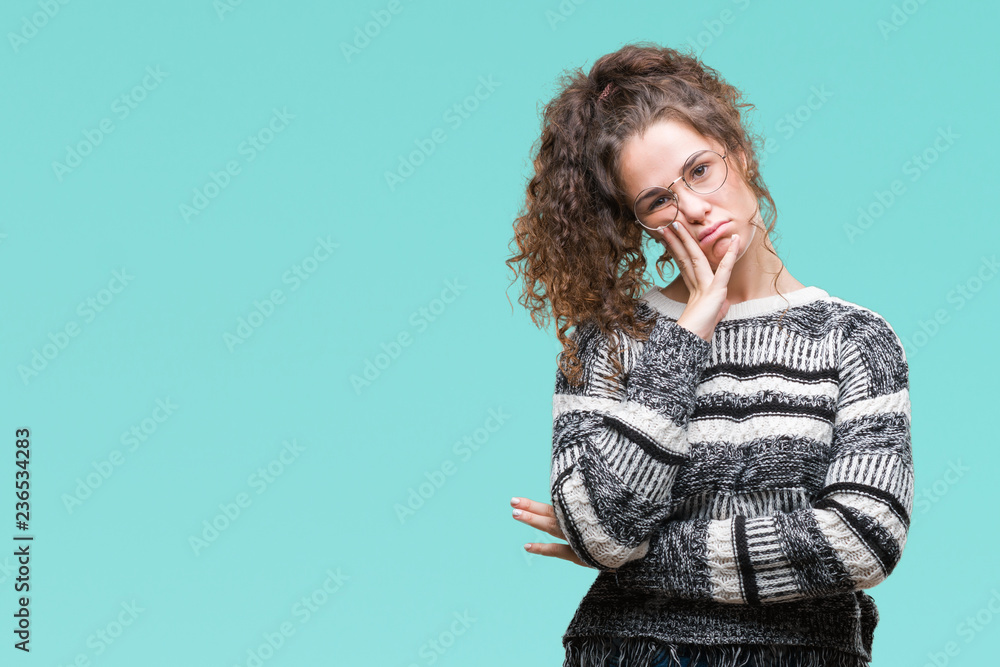 Beautiful brunette curly hair young girl wearing glasses over isolated background thinking looking tired and bored with depression problems with crossed arms. Beautiful brunette curly hair young girl wearing glasses over isolated background thinking looking tired and bored with depression problems with crossed arms.