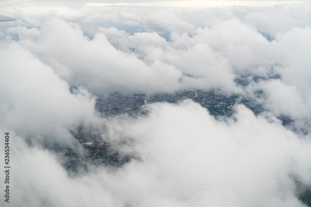 Flying over London on a cloudy day Flying over London on a cloudy day